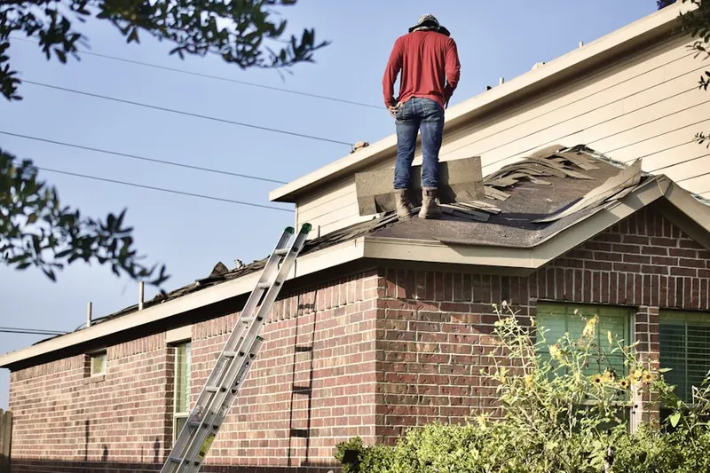 Professional roofer working on a residential roof in Griffith Park